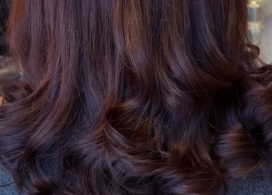 Luxurious brunette curls at Extensions With Kirsty in Trowbridge, England, GB showcasing stunning salon results.