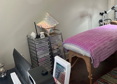 Cozy treatment room at K. Marie Aesthetics Atlanta Bookings, South Fulton, Georgia. Features a massage table and decor.