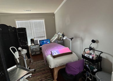 Treatment room at K. Marie Aesthetics Atlanta Bookings in South Fulton, Georgia, US, showcasing a cozy setup.