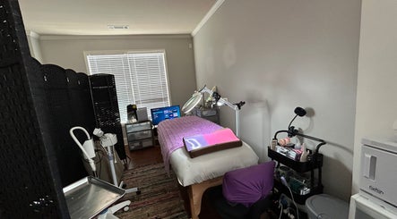 Treatment room at K. Marie Aesthetics Atlanta Bookings in South Fulton, Georgia, US, showcasing a cozy setup.