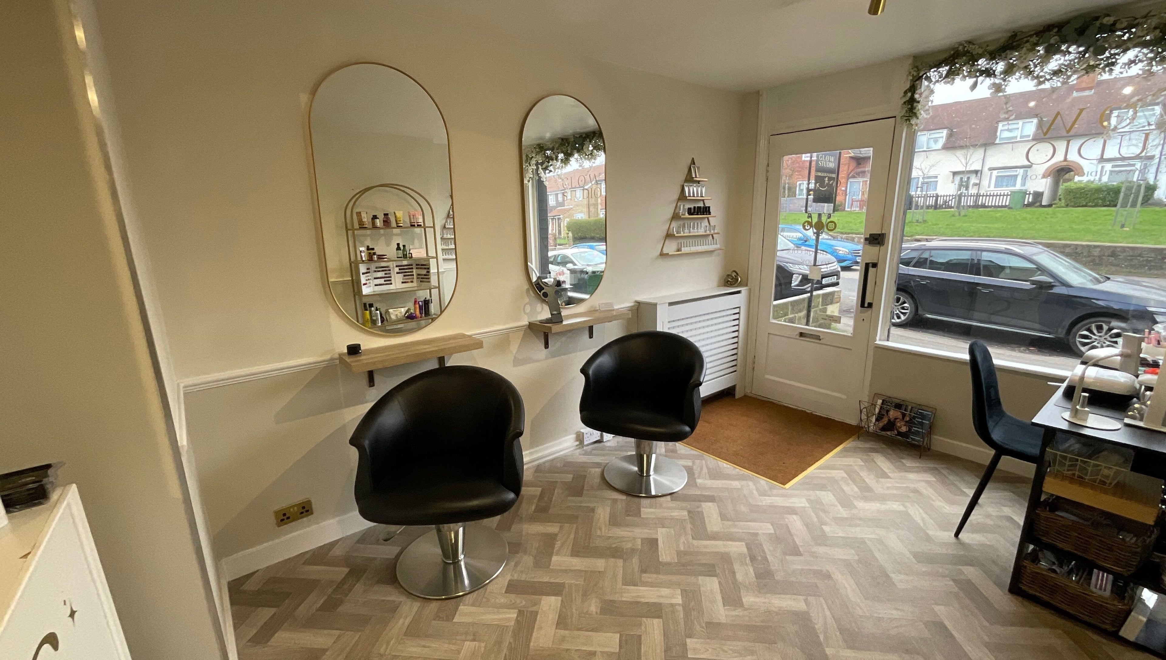 Chic salon interior with styling stations at Glow Studio, Maidstone, England, GB.