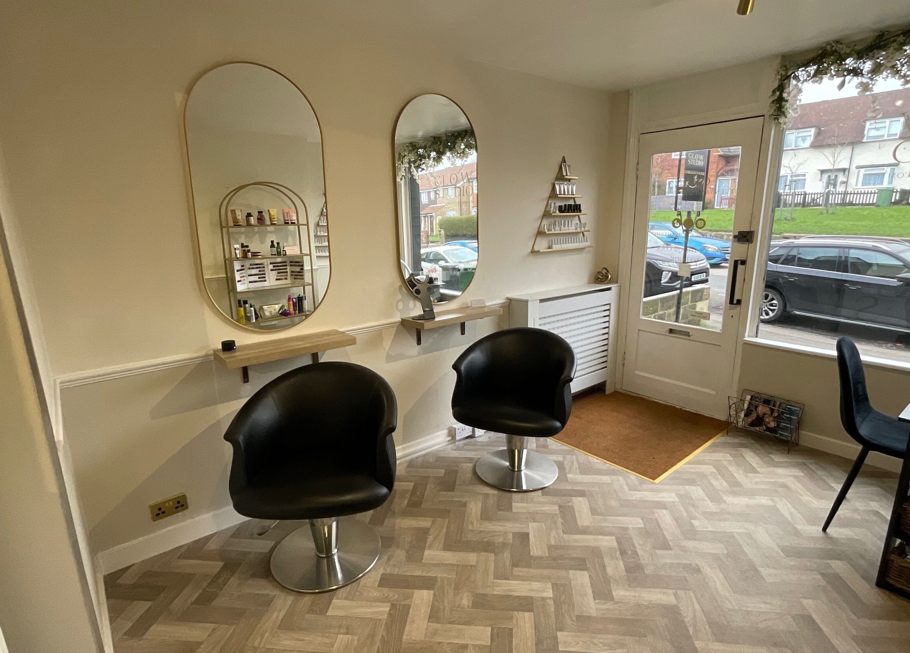 Chic salon interior with styling stations at Glow Studio, Maidstone, England, GB.