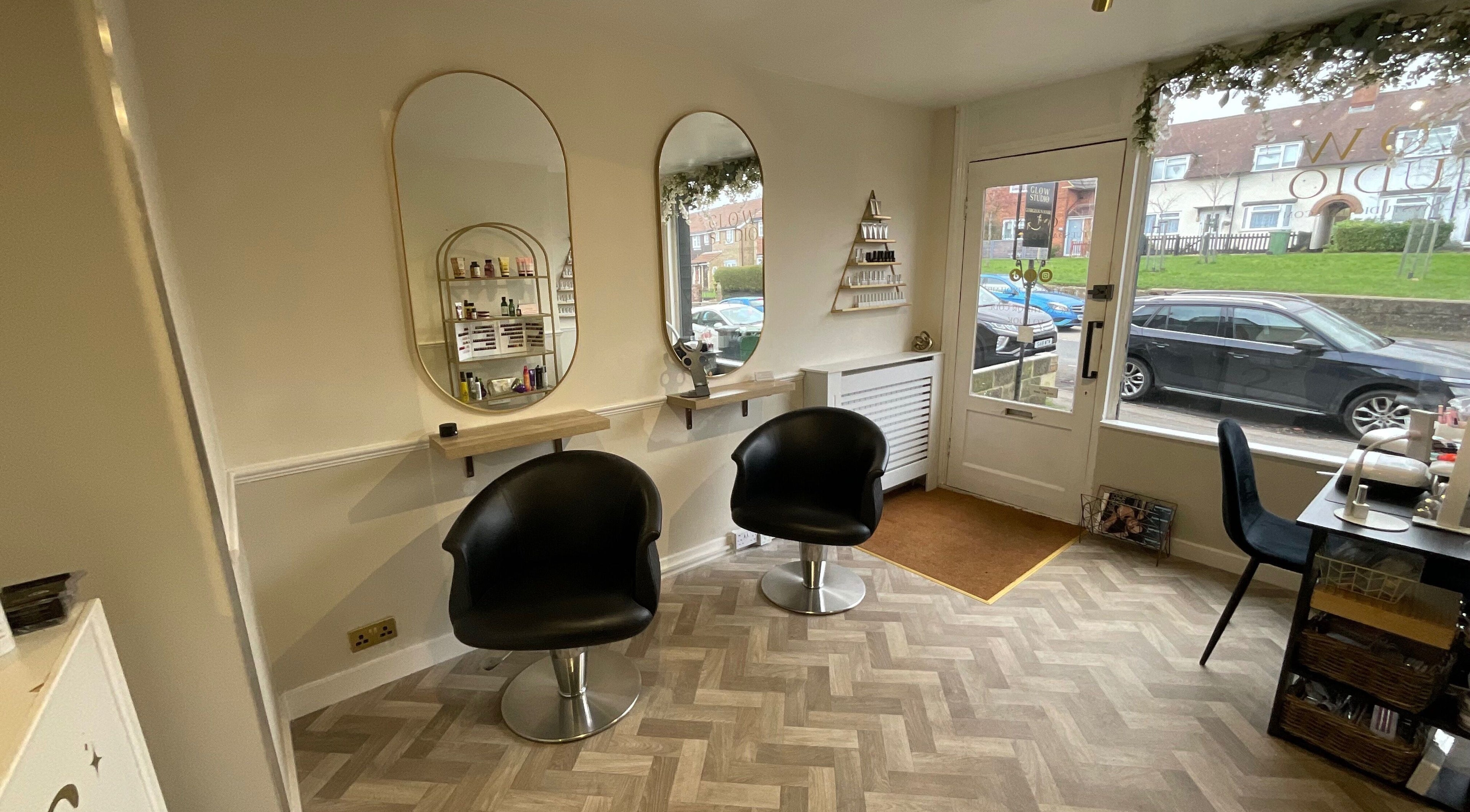 Chic salon interior with styling stations at Glow Studio, Maidstone, England, GB.