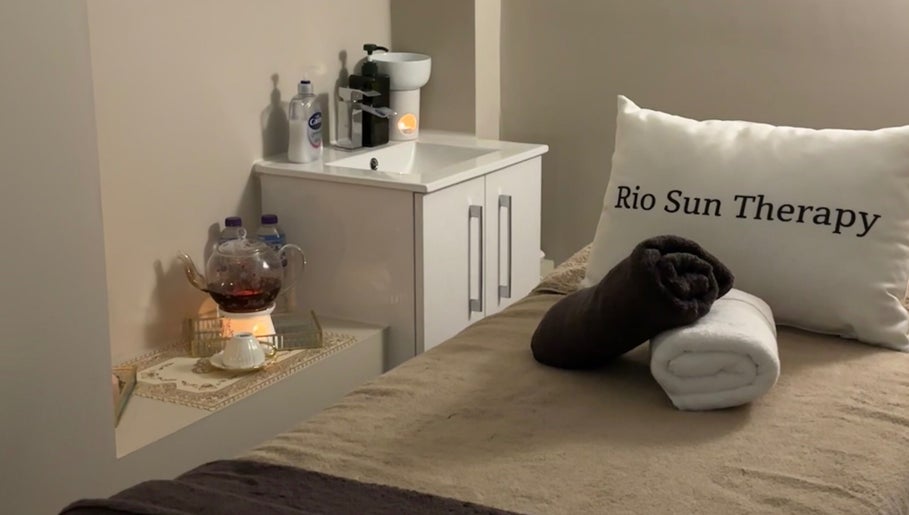 Rio Sun Massage Therapy relaxation room with towels and a teapot in London, England, GB.