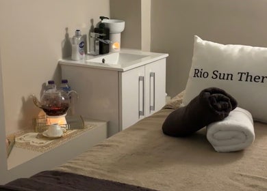 Rio Sun Massage Therapy relaxation room with towels and a teapot in London, England, GB.