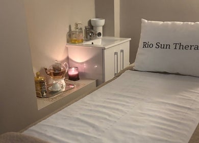 Relaxing massage bed at Rio Sun Massage Therapy, London, England, GB with comforting decor.