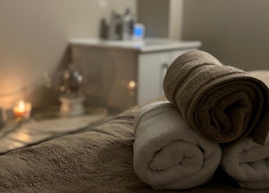 Rolled towels at Rio Sun Massage Therapy in London, England, GB, creating a calm and inviting atmosphere.