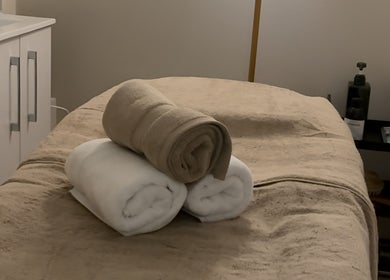 Massage table at Rio Sun Massage Therapy in London, England, GB with cozy towels and soothing ambiance.