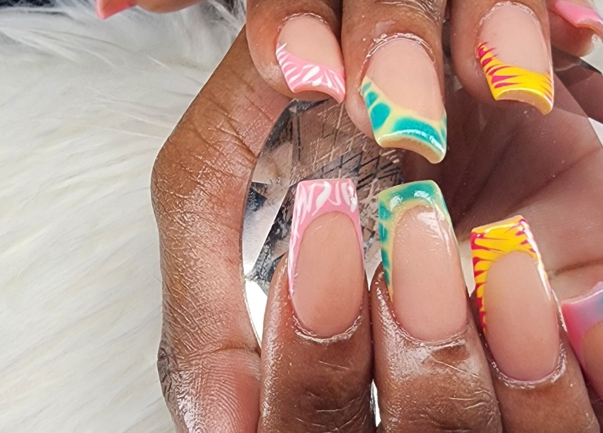 Creative nail art design by Toyazz Touch Of Beauty in Ocho Rios, St. Ann Parish, JM showcasing vibrant colors.