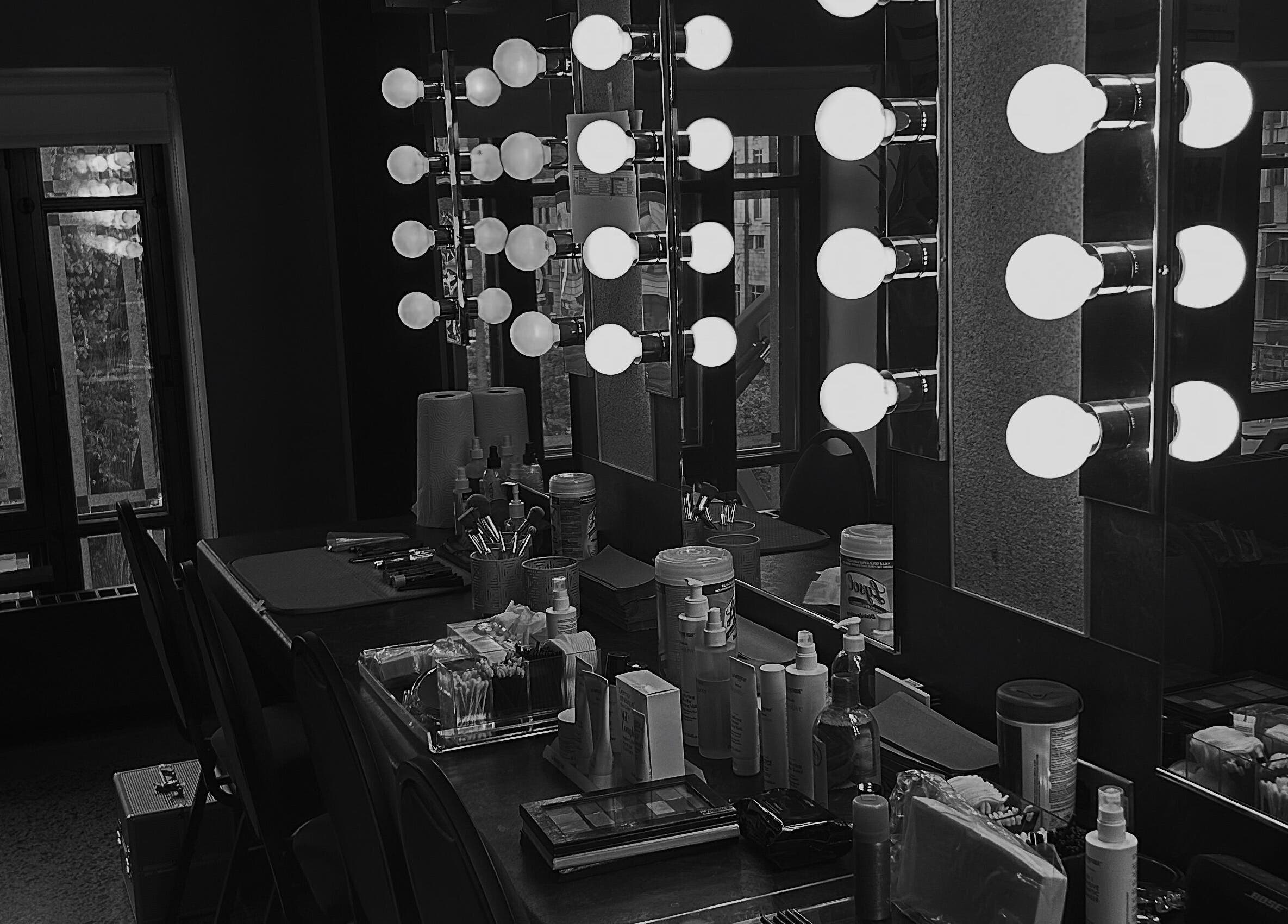 Elegant makeup station with lit mirrors at BareGlow By Sarah, Blainville, Québec, CA, exuding luxury and style.