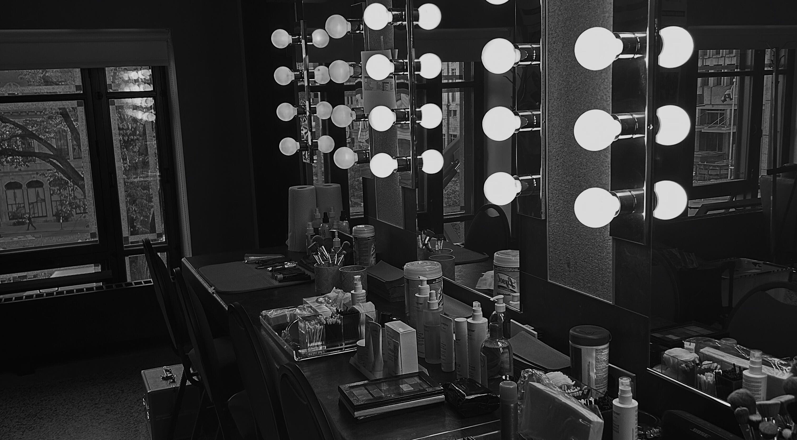 Elegant makeup station with lit mirrors at BareGlow By Sarah, Blainville, Québec, CA, exuding luxury and style.