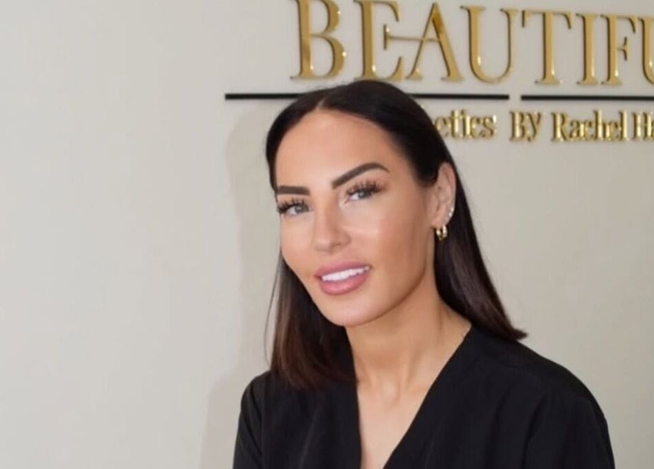 Aesthetician at Aesthetics By Rachel Haq in Oldham, England, GB with the BEAUTIFUL sign in the background.