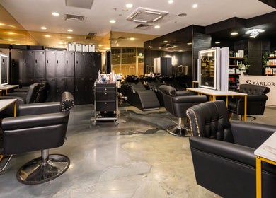 Experience luxury at S Parlor Hair in Melbourne, Victoria, AU with plush chairs and chic salon decor.