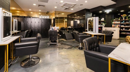 Experience luxury at S Parlor Hair in Melbourne, Victoria, AU with plush chairs and chic salon decor.