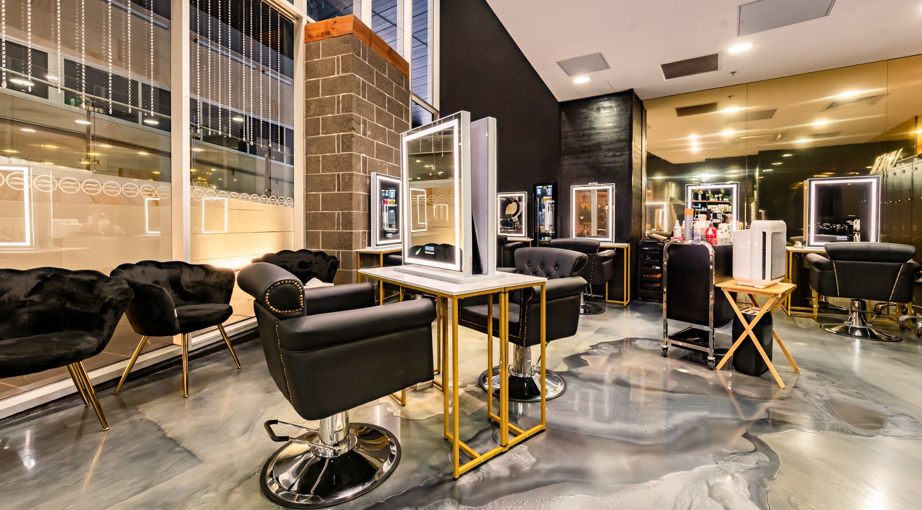 Luxurious interior of S Parlor Hair in Melbourne, Victoria, AU with stylish salon chairs and mirrors.