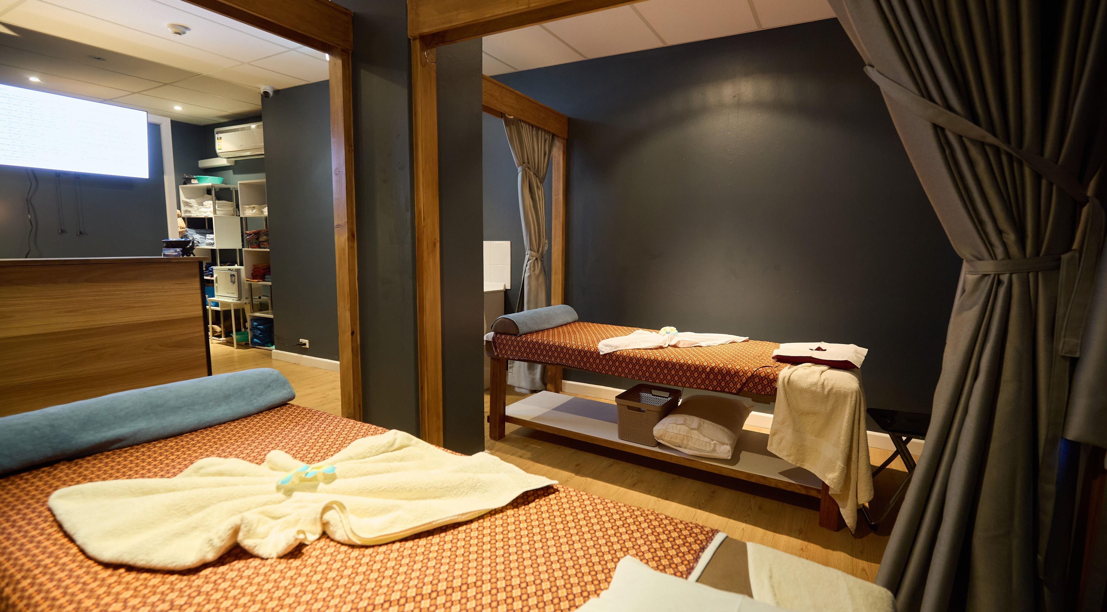 Relaxing massage room at Chom Thai Massage, Sydney, New South Wales, AU with cozy ambiance and soothing decor.