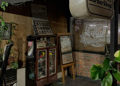Cozy corner of Gunting karat Barbershop(Hannan) in Banting, Selangor, MY with vintage decor and greenery.