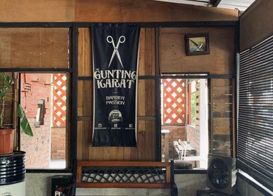 Interior of Gunting Karat Barbershop(Hannan) featuring wooden decor in Banting, Selangor, MY.