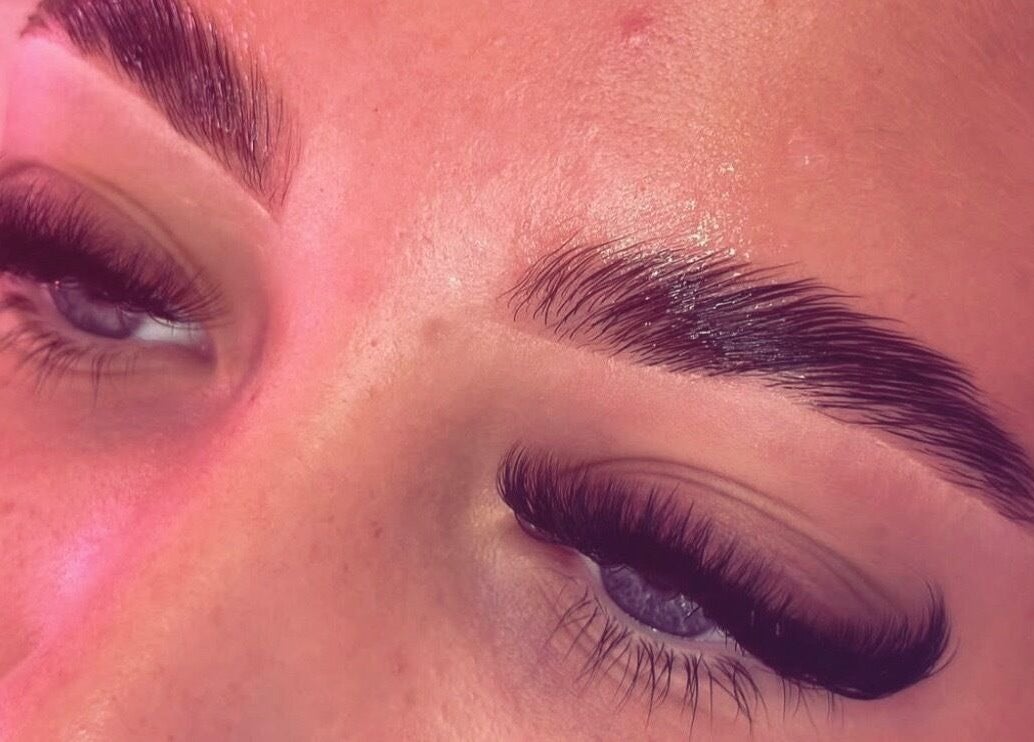 Close-up of beautifully styled eyelashes and eyebrows at MLG Extensions, Watford, England, GB.