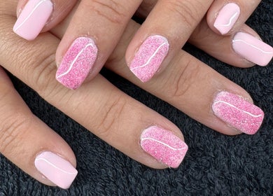 Elegant pink nails with glitter at The Rose Collection, Weston-super-Mare, England, GB.