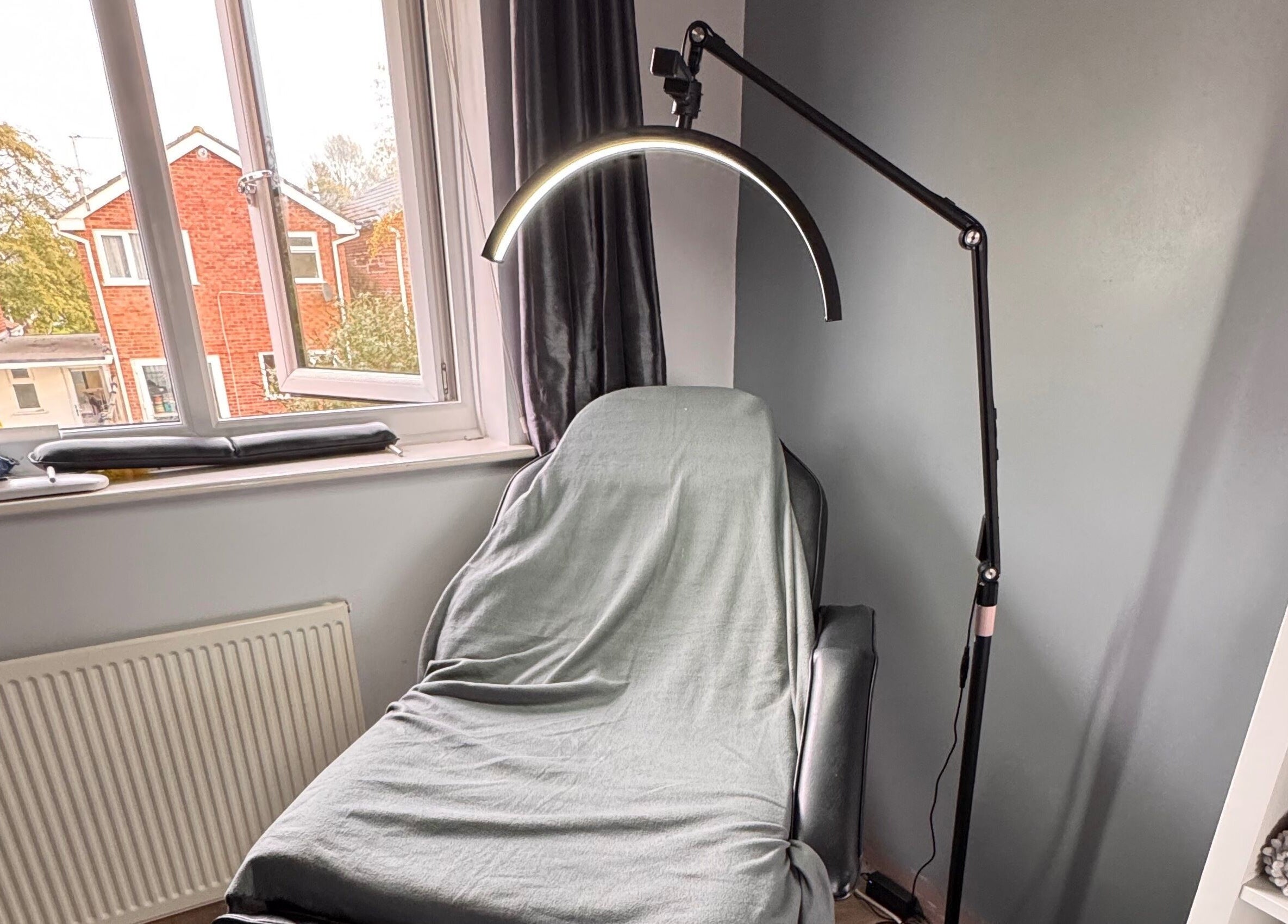 Relaxing treatment room at The Rose Collection, Weston-super-mare, England, GB, featuring a treatment chair.