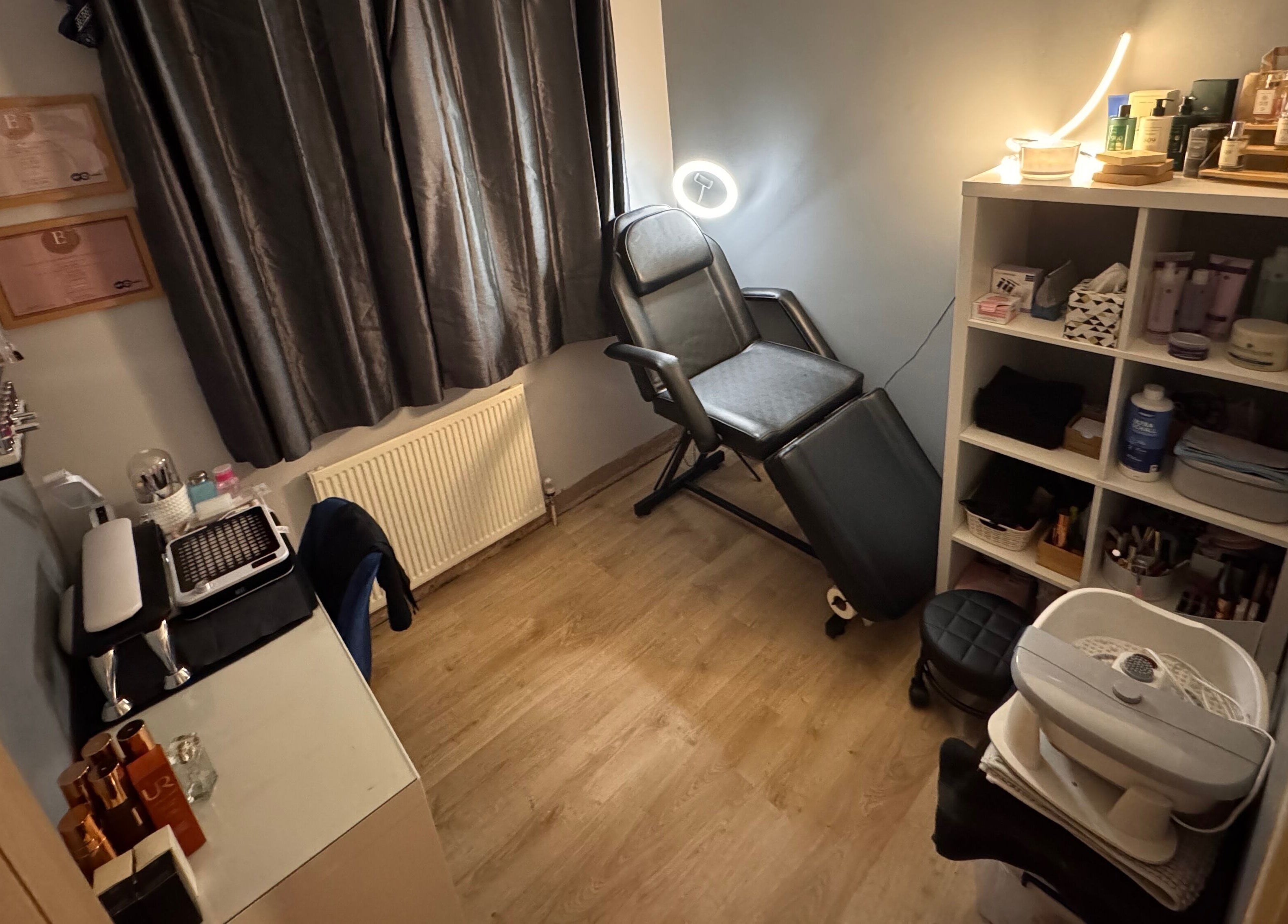 Relaxing beauty room at The Rose Collection, Weston-super-Mare, England, GB with chair and shelves.