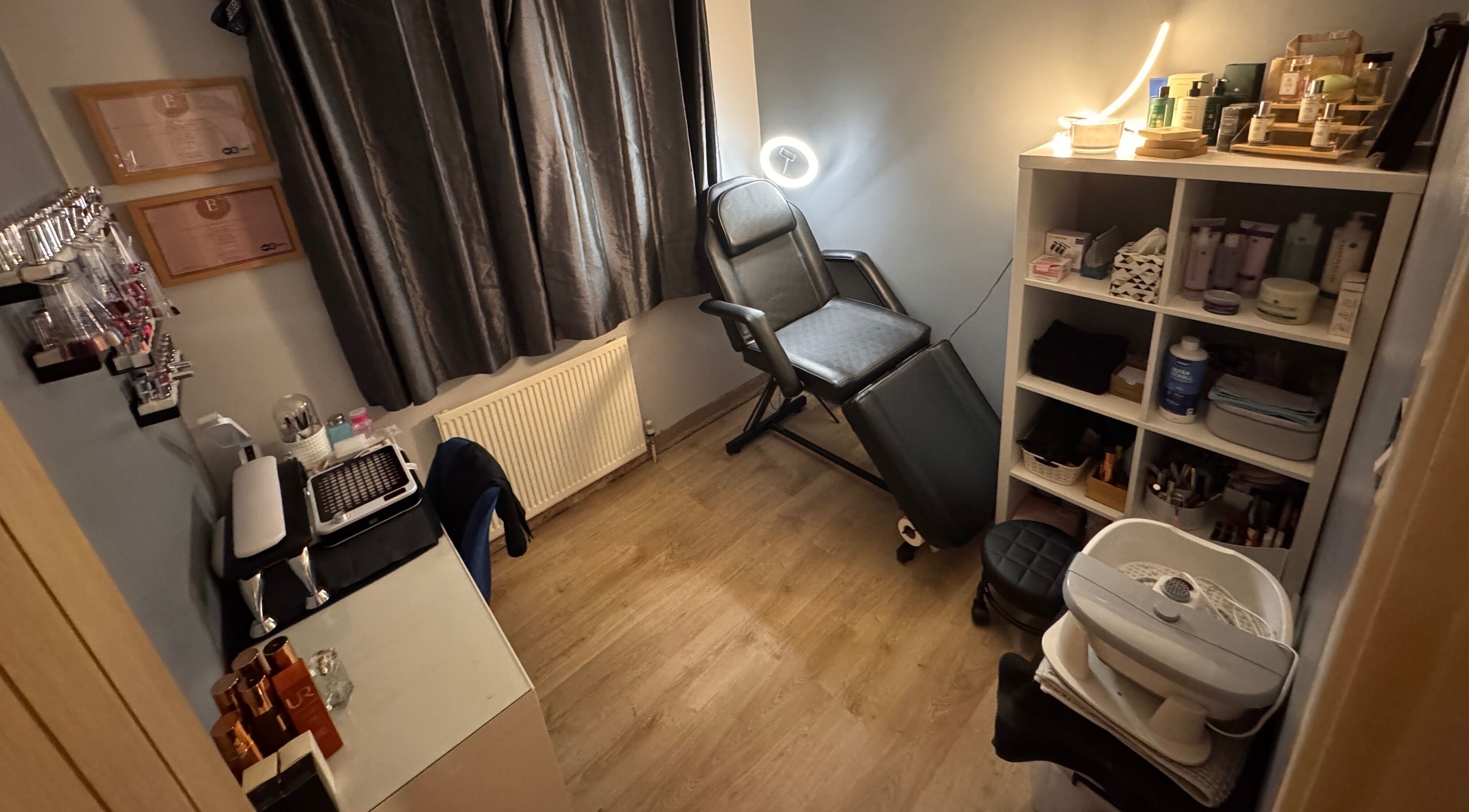 Relaxing beauty room at The Rose Collection, Weston-super-Mare, England, GB with chair and shelves.
