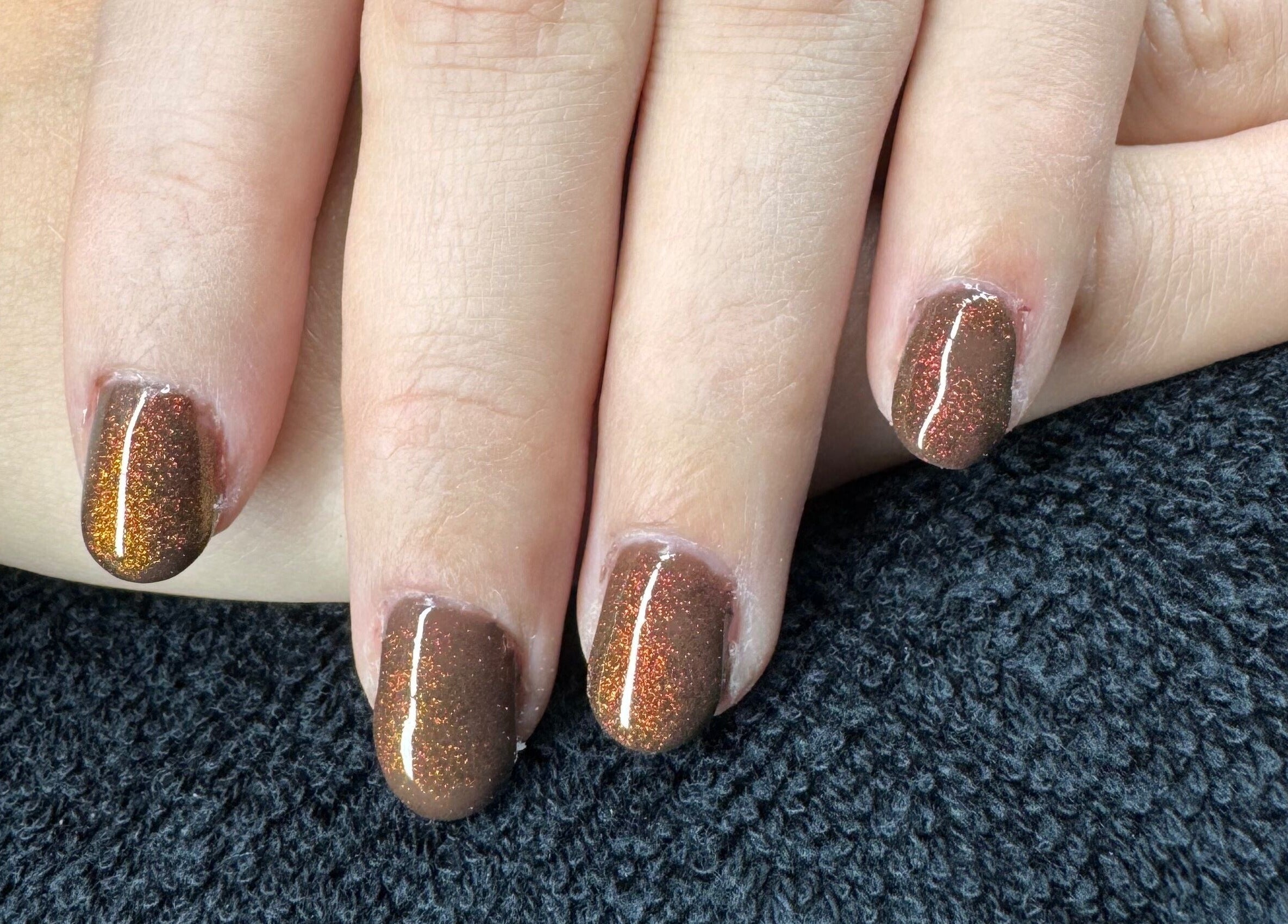 Shimmering brown nails at The Rose Collection, Weston-super-mare, England, GB.