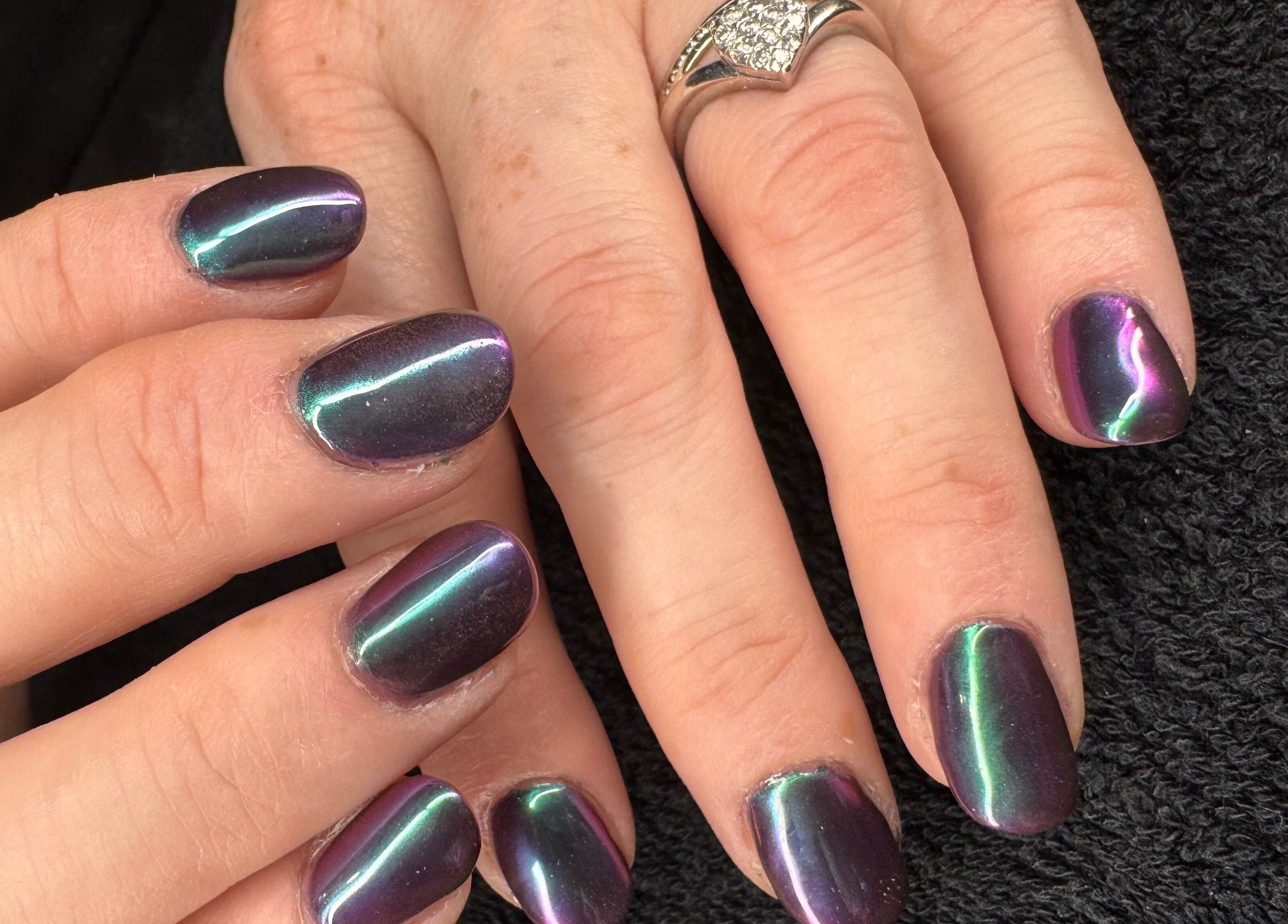 Colorful manicured nails from The Rose Collection, Weston-super-mare, England, GB on display.