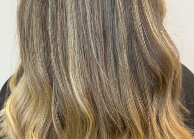 Elegant wavy hairstyle with subtle highlights at Hair by Jodie in Kilmarnock, Scotland, GB.