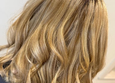 Blonde wavy hairstyle at Hair by Jodie, Kilmarnock, Scotland, GB. Experience luxurious hair treatments.