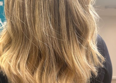 Wavy blonde hair styled at Hair by Jodie, Kilmarnock, Scotland, GB, showcasing soft texture and shine.