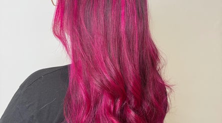Vibrant pink hair styled at Hair by Jodie, Kilmarnock, Scotland, GB, showcasing expert color techniques.