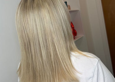 Stylish blonde hairstyle at Hair by Jodie, Kilmarnock, Scotland, GB, showcasing sleek elegance.