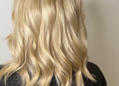 Blonde wavy hairstyle created at Hair by Jodie, Kilmarnock, Scotland, GB, showcasing vibrant gold tones.