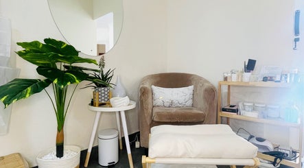 Serene waiting area at Tips & Toes, Boksburg, Gauteng, ZA with a plush chair and plants.