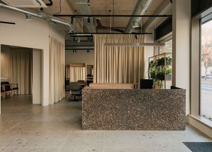 Spacious interior of Glasshouse Salon in London, England, GB featuring modern decor and natural lighting.
