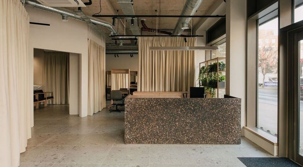 Spacious interior of Glasshouse Salon in London, England, GB featuring modern decor and natural lighting.