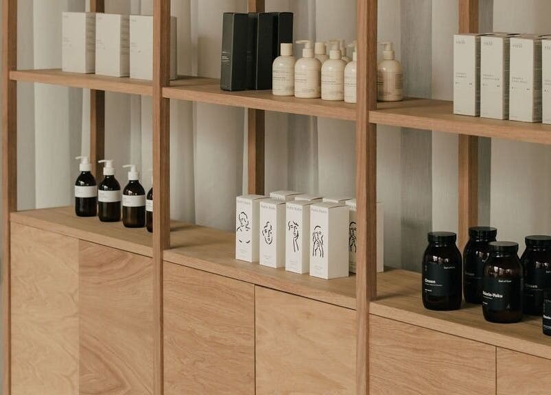 Display shelves with beauty products at Glasshouse Salon, London, England, GB, showcasing elegance and style.