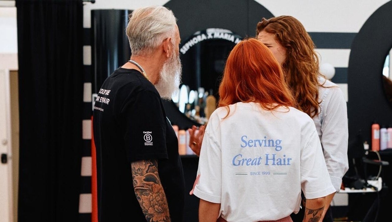 Team consulting with client at Kay Sheriff Hair in Congleton, England, GB for a stylish haircut.