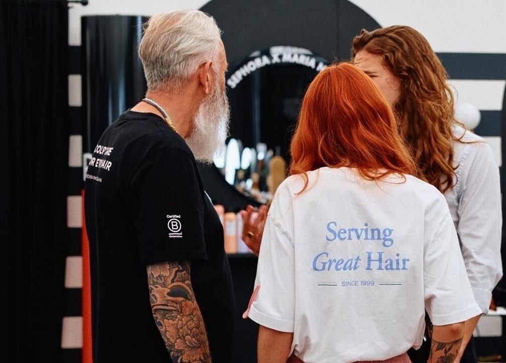 Team consulting with client at Kay Sheriff Hair in Congleton, England, GB for a stylish haircut.