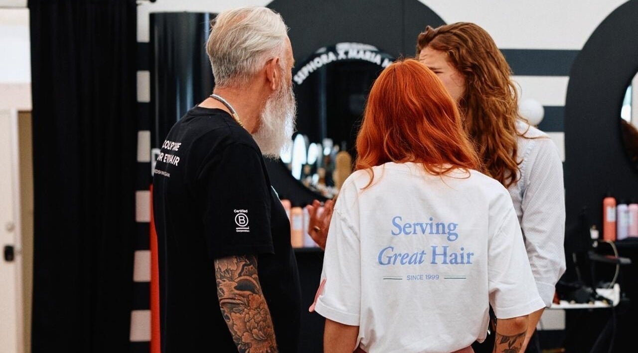 Team consulting with client at Kay Sheriff Hair in Congleton, England, GB for a stylish haircut.