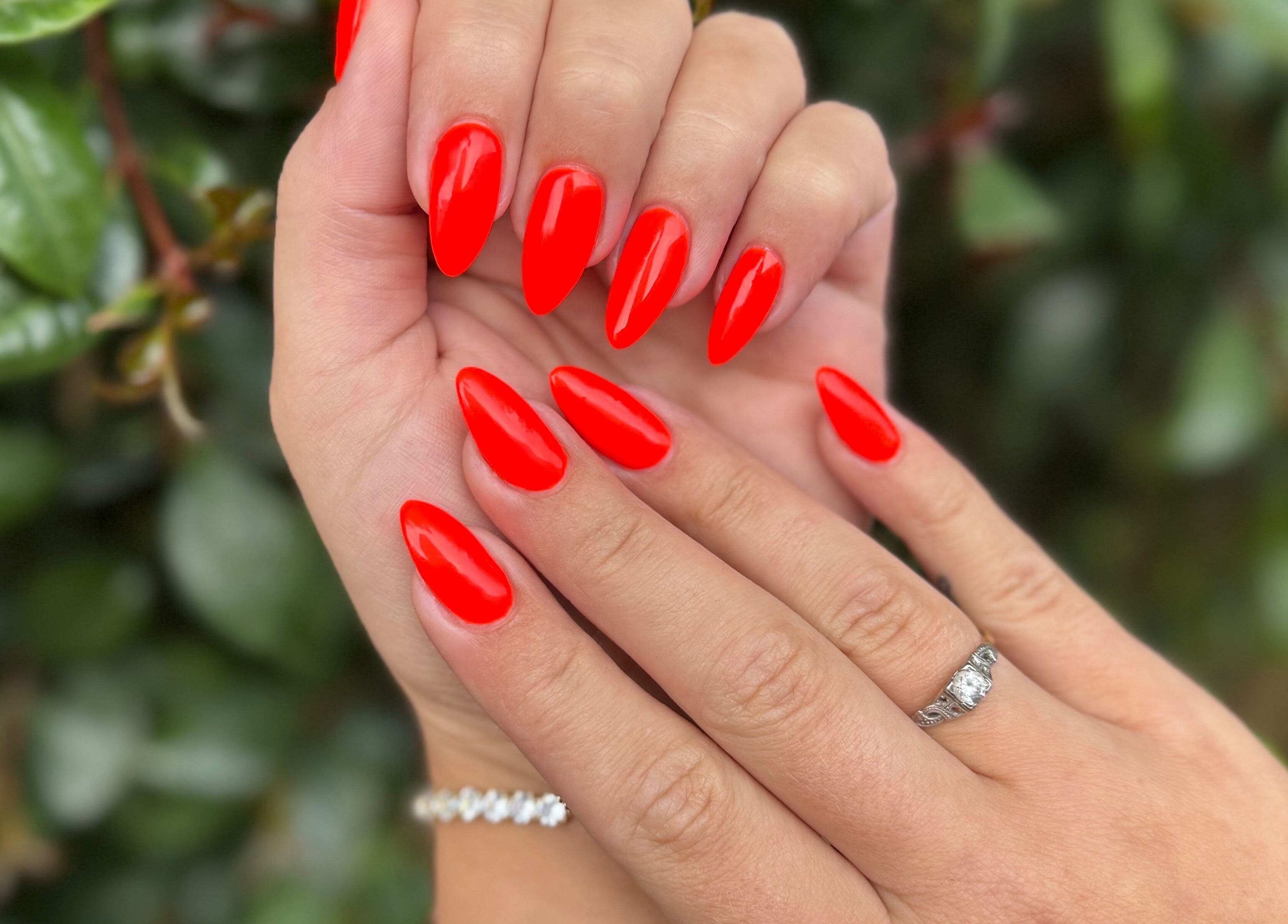Bright red manicured nails at Celesté, Madré and Nadia at The Fountain, Port Elizabeth, Eastern Cape, ZA.