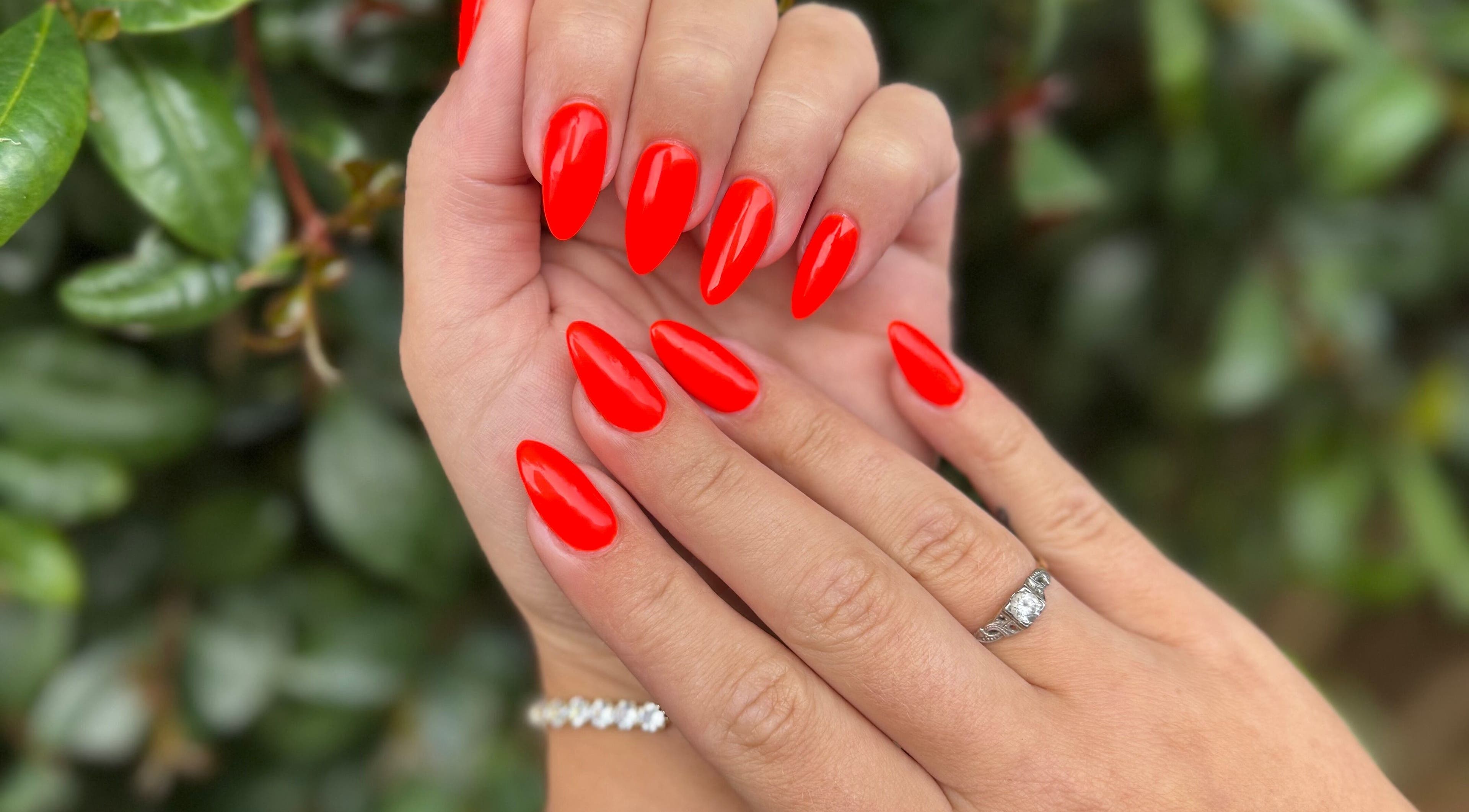 Bright red manicured nails at Celesté, Madré and Nadia at The Fountain, Port Elizabeth, Eastern Cape, ZA.