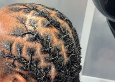 Intricate cornrow hairstyle at Banusti Beauty LLC, Billerica, Massachusetts, US, showcasing expert styling.