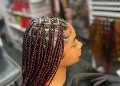 Intricate braided hairstyle at Banusti Beauty LLC in Billerica, Massachusetts, US. Showcases expert styling.
