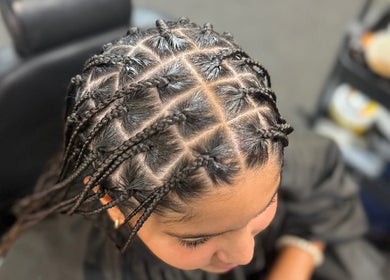 Intricate braided hairstyle at Banusti Beauty LLC in Billerica, Massachusetts, US.