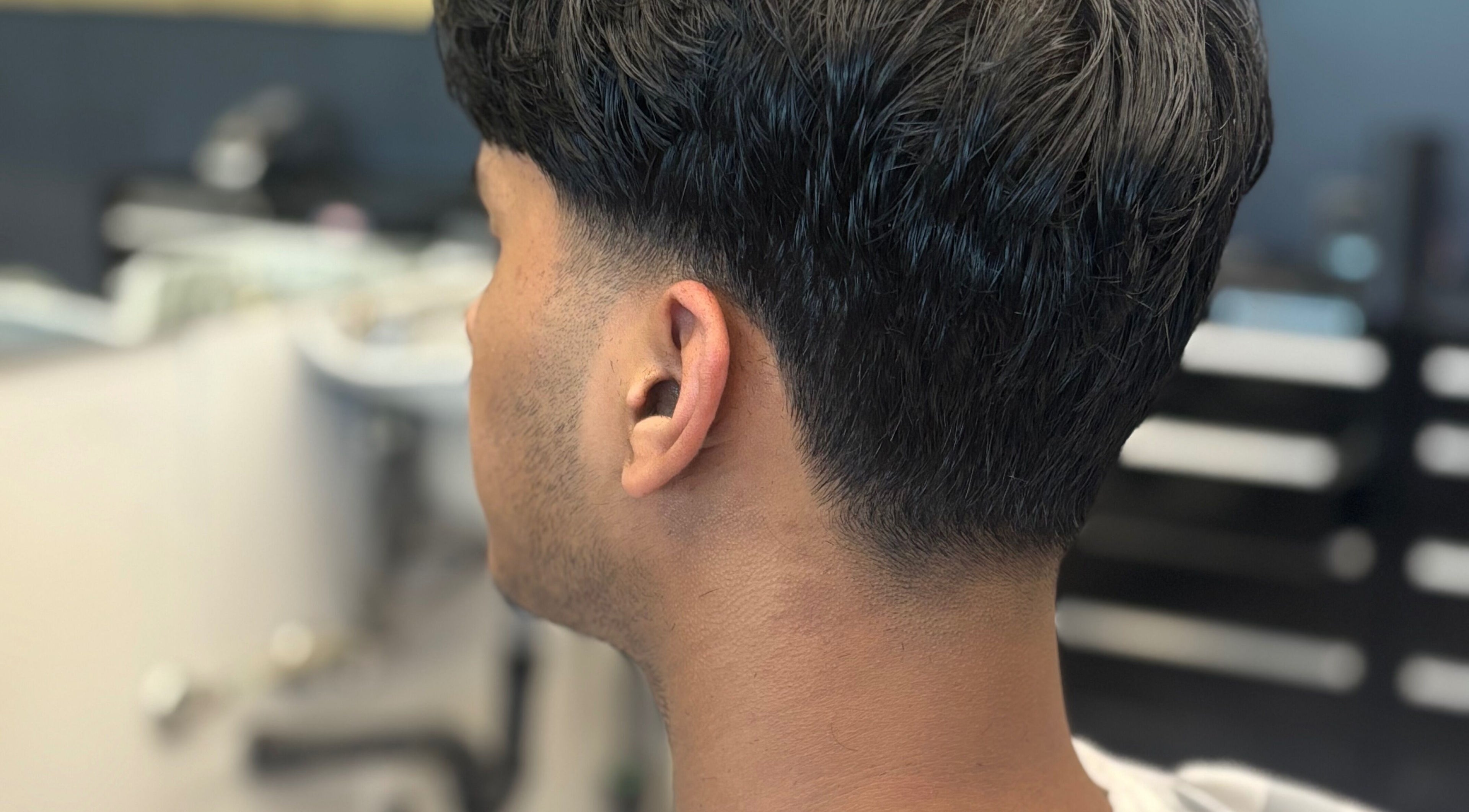 Fresh haircut at Mankind barbershop, Calgary, Alberta, CA, showcasing detailed grooming skills.