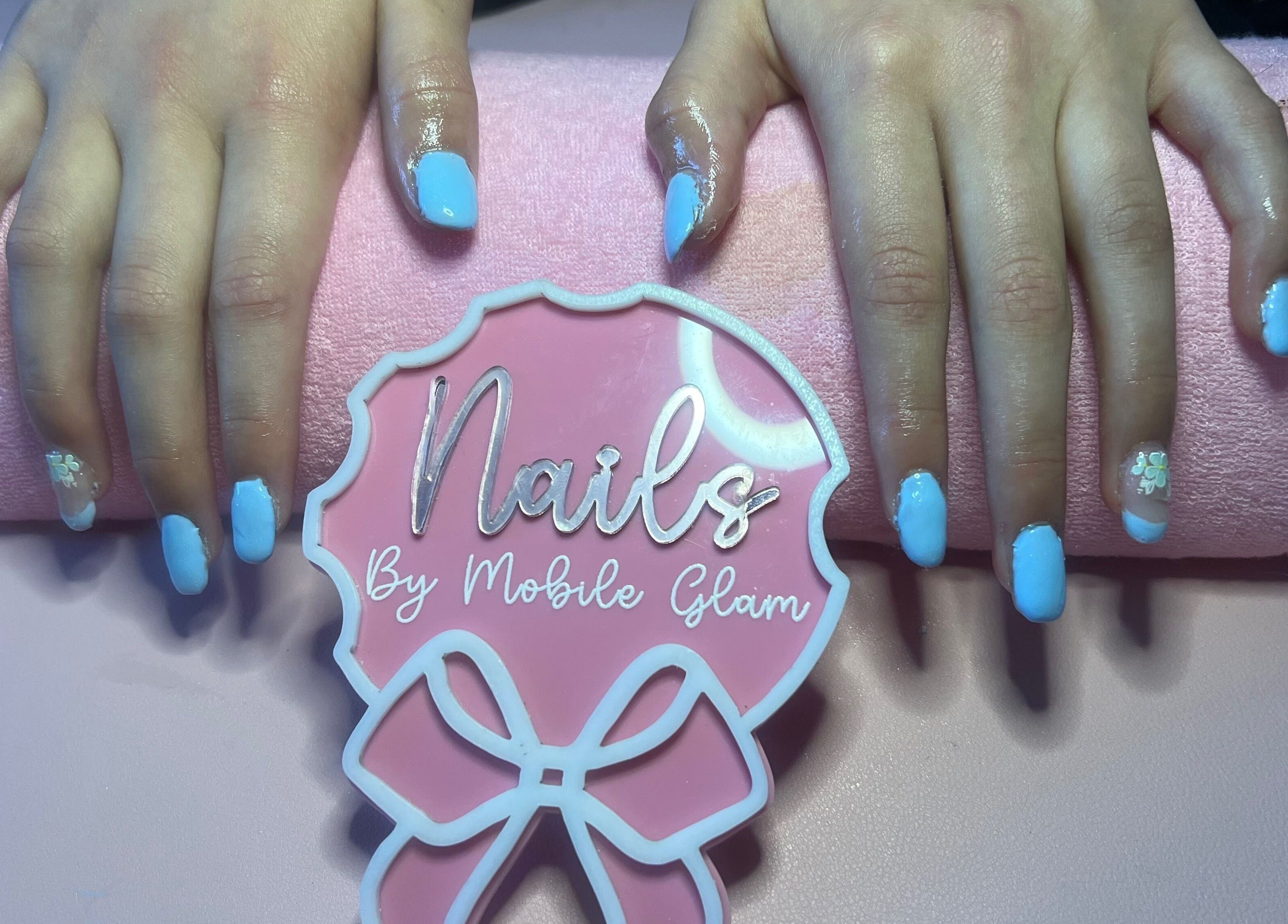 Elegant blue manicure at Mobile Glam, Caerphilly, Wales, GB, showcasing stunning nail art design.