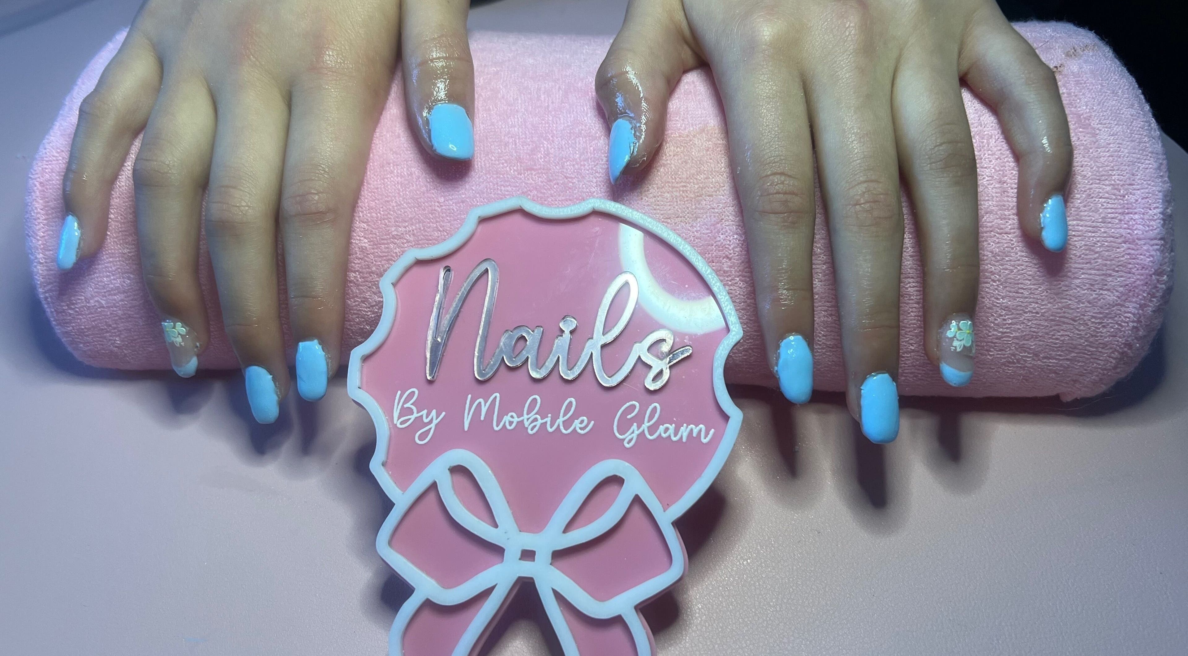 Elegant blue manicure at Mobile Glam, Caerphilly, Wales, GB, showcasing stunning nail art design.